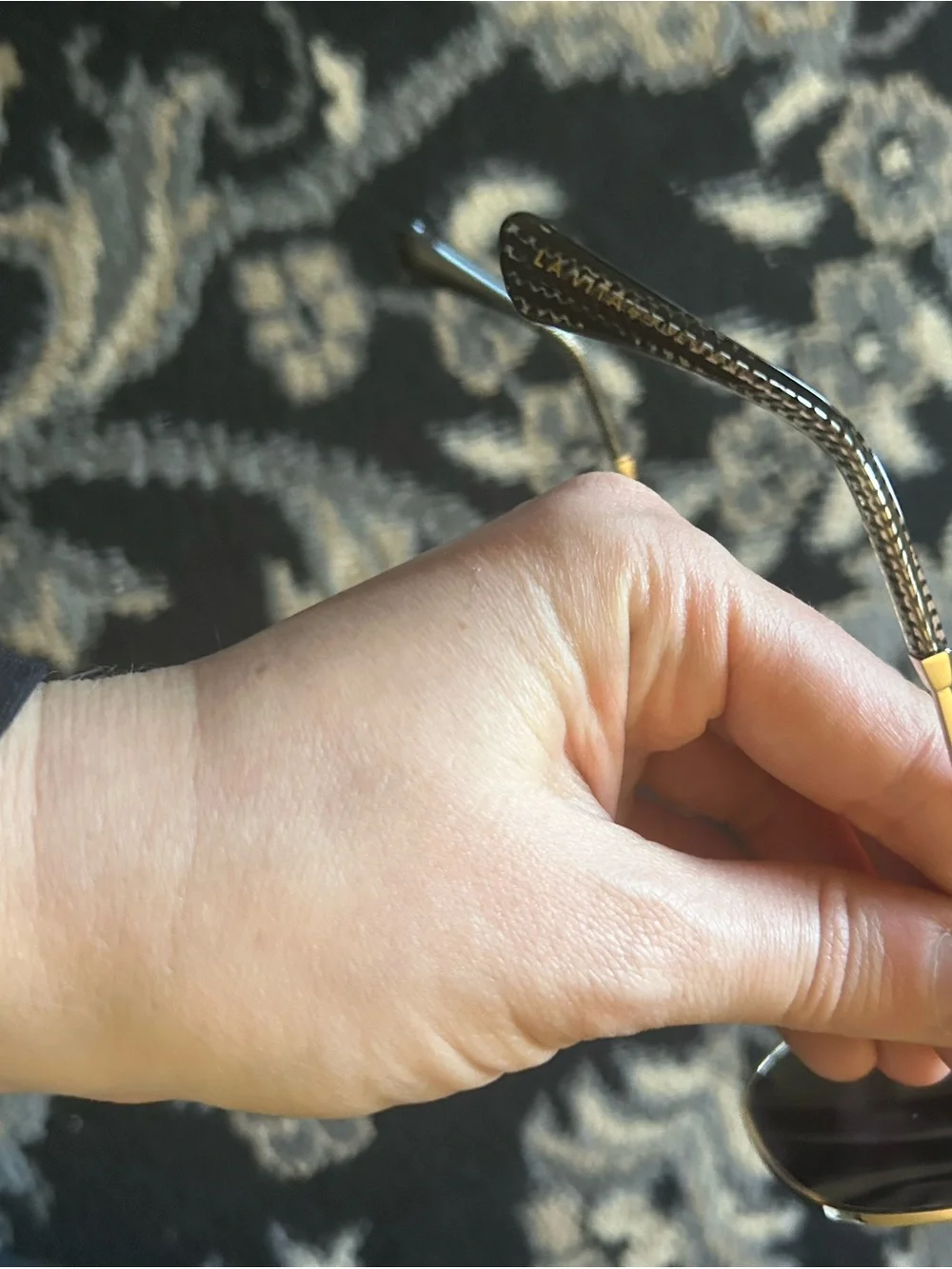 Gold Metal Frame Sunglasses, hatched dark lenses.
